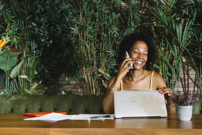 photo of a smiling lady on a business call